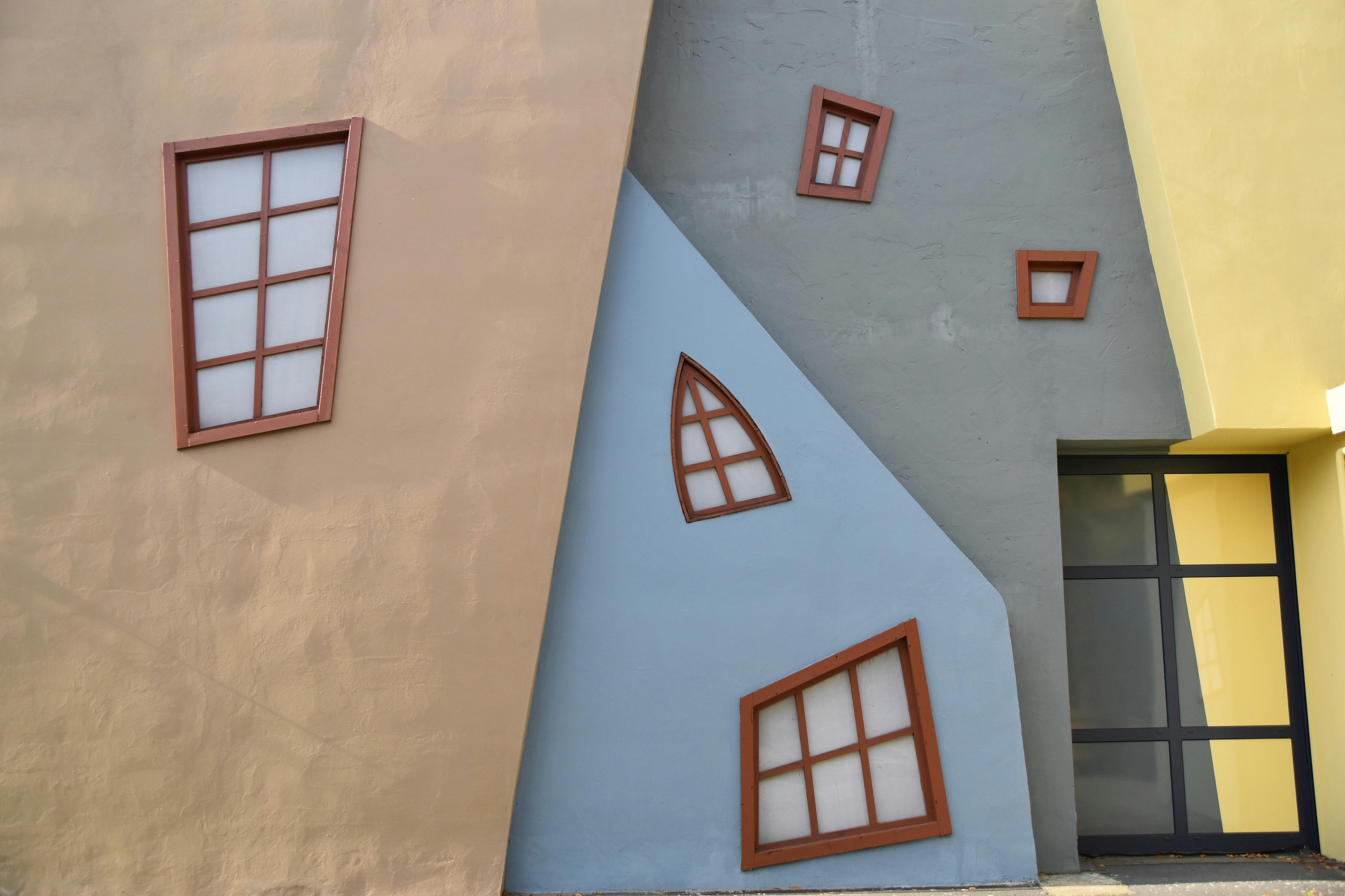 Painter rolling low-VOC paint on a commercial wall