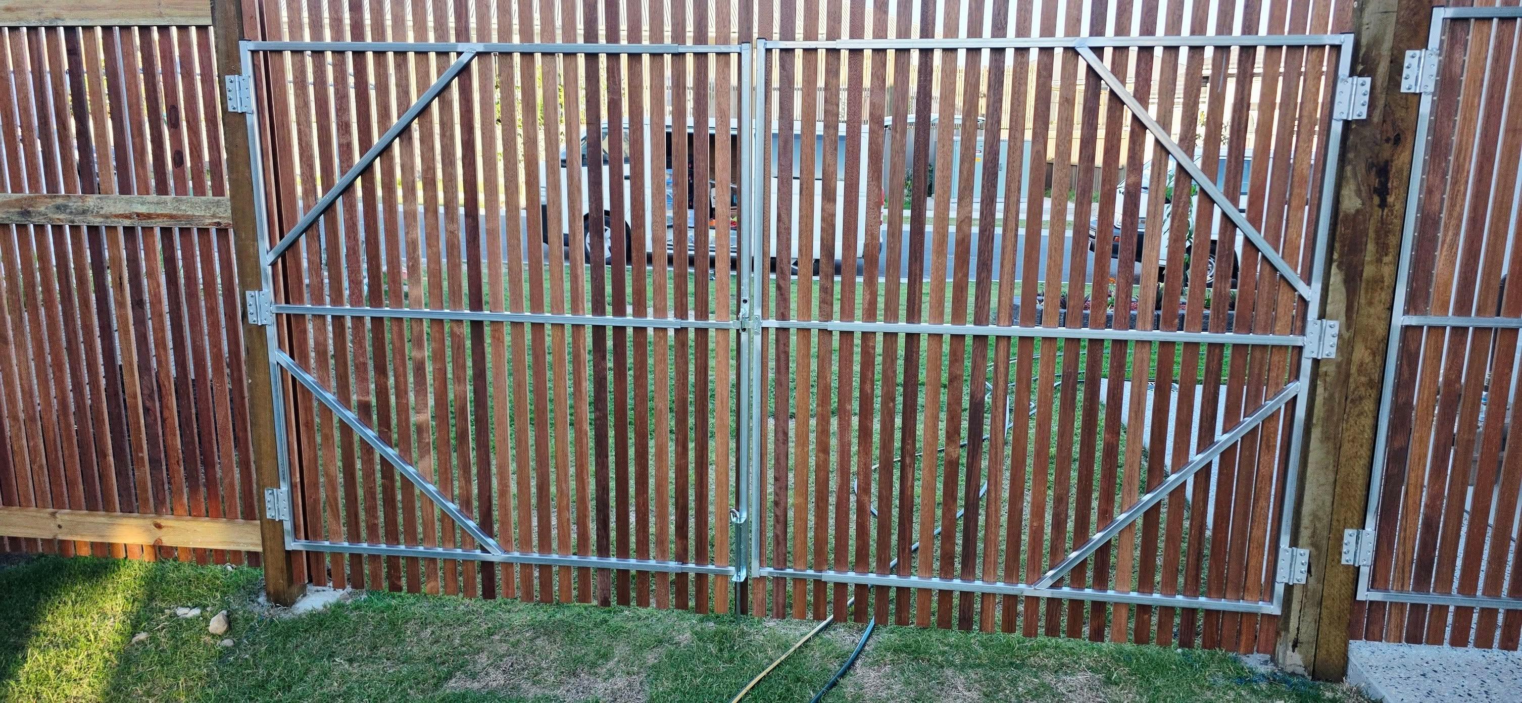 New fencing installed along a landscaped path